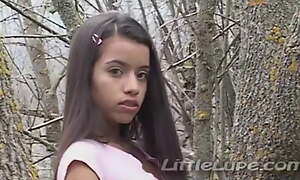 Transient Lupe masturbates her tight pussy in the woods