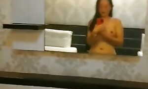 Cute Asian girl alongside hotel court polish off selfie for her body