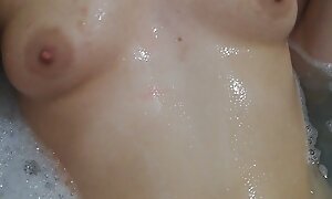 Glum filial teen playing with soapy boobs