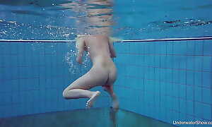 Russian blonde quorum swimming in the pool