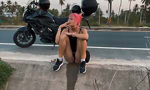 Motorbike girlfriend peeing on the top of the roadside
